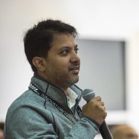 Customer asking question in microphone standing