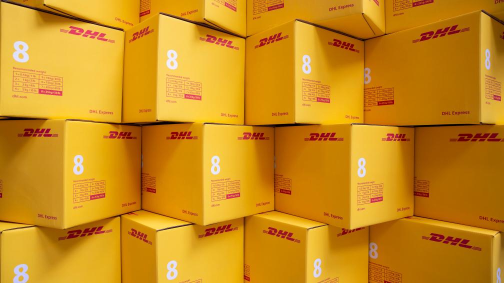 Stacked DHL Express boxes.
