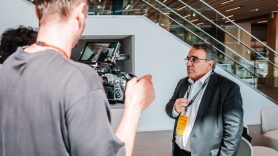 Speaker at DHL event is interviewed off-stage