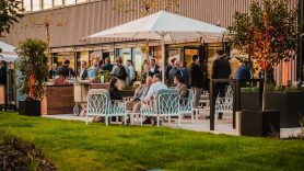 Wide shot of outdoor patio area during customer event