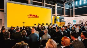 Image of DHL New Energy Logistics logo on stage