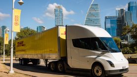 DHL lorry in front of Austin skyline