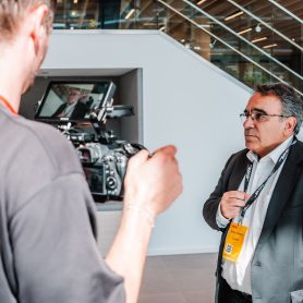 Speaker at DHL event is interviewed off-stage