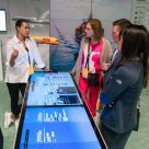 Delegates talk in the sustainability zone at Now & Next