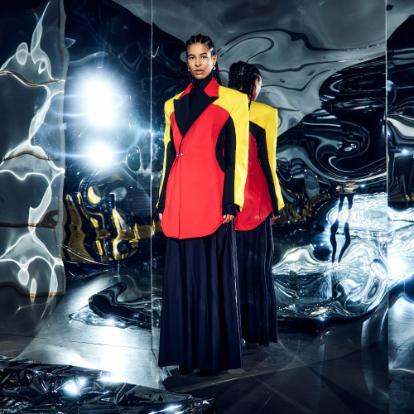 Fashion model in front of mirror wearing clothes inspired by DHL