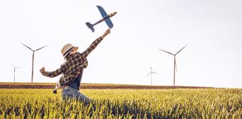 Boy playing with a model airplane