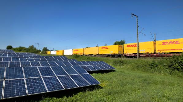 Train with DHL lettering and solar panels