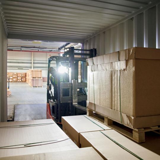 forklift-driver-loads-cargo-truck