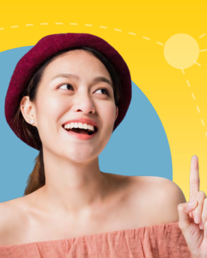 Happy woman celebrating pointing upwards.