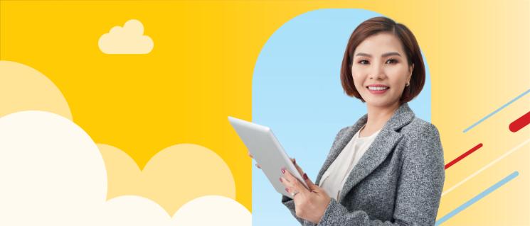 Woman holding a tablet device with charts and looking at the camera.
