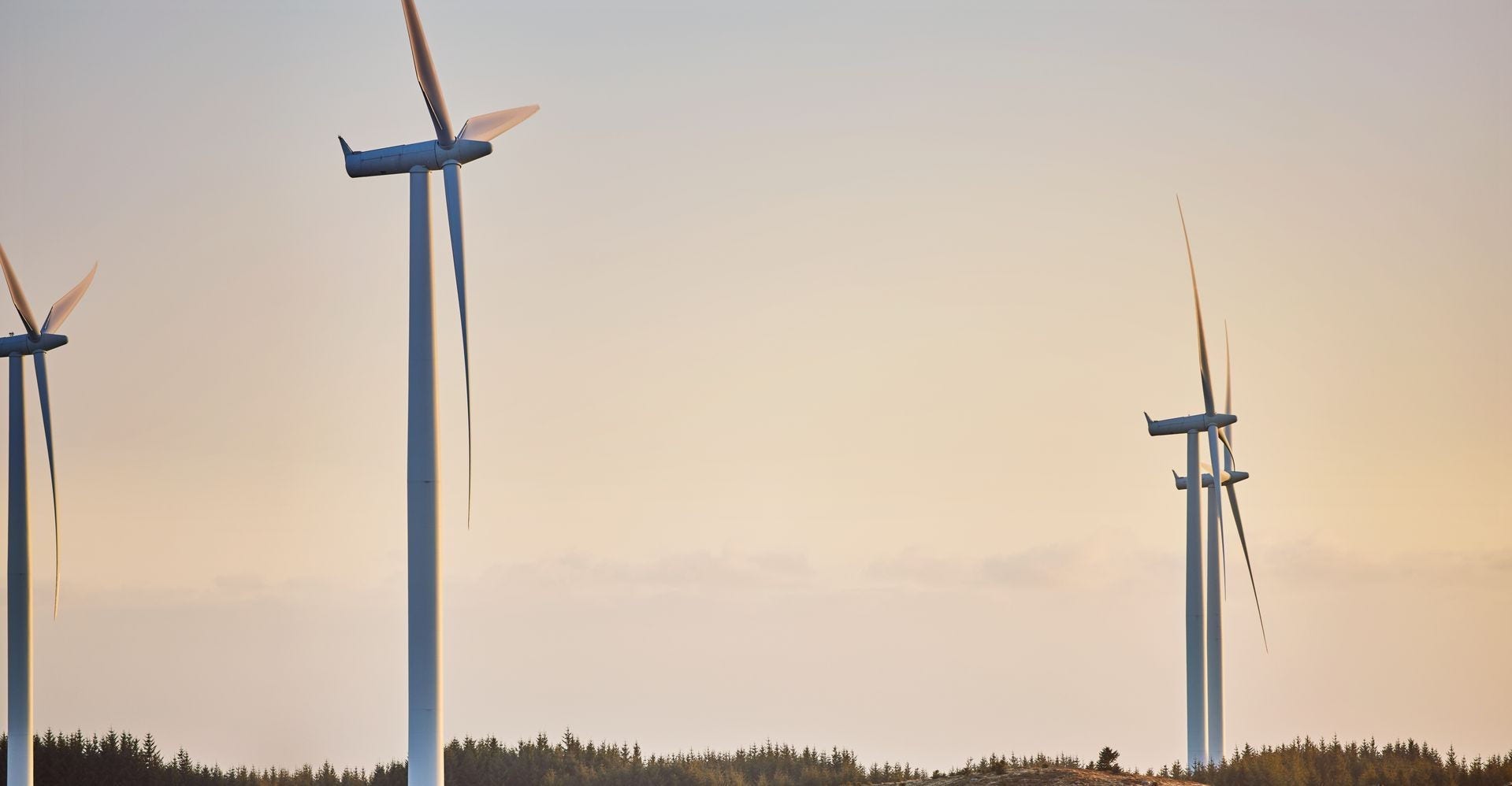 Windmills in the background as a DHL Express truck makes deliveries
