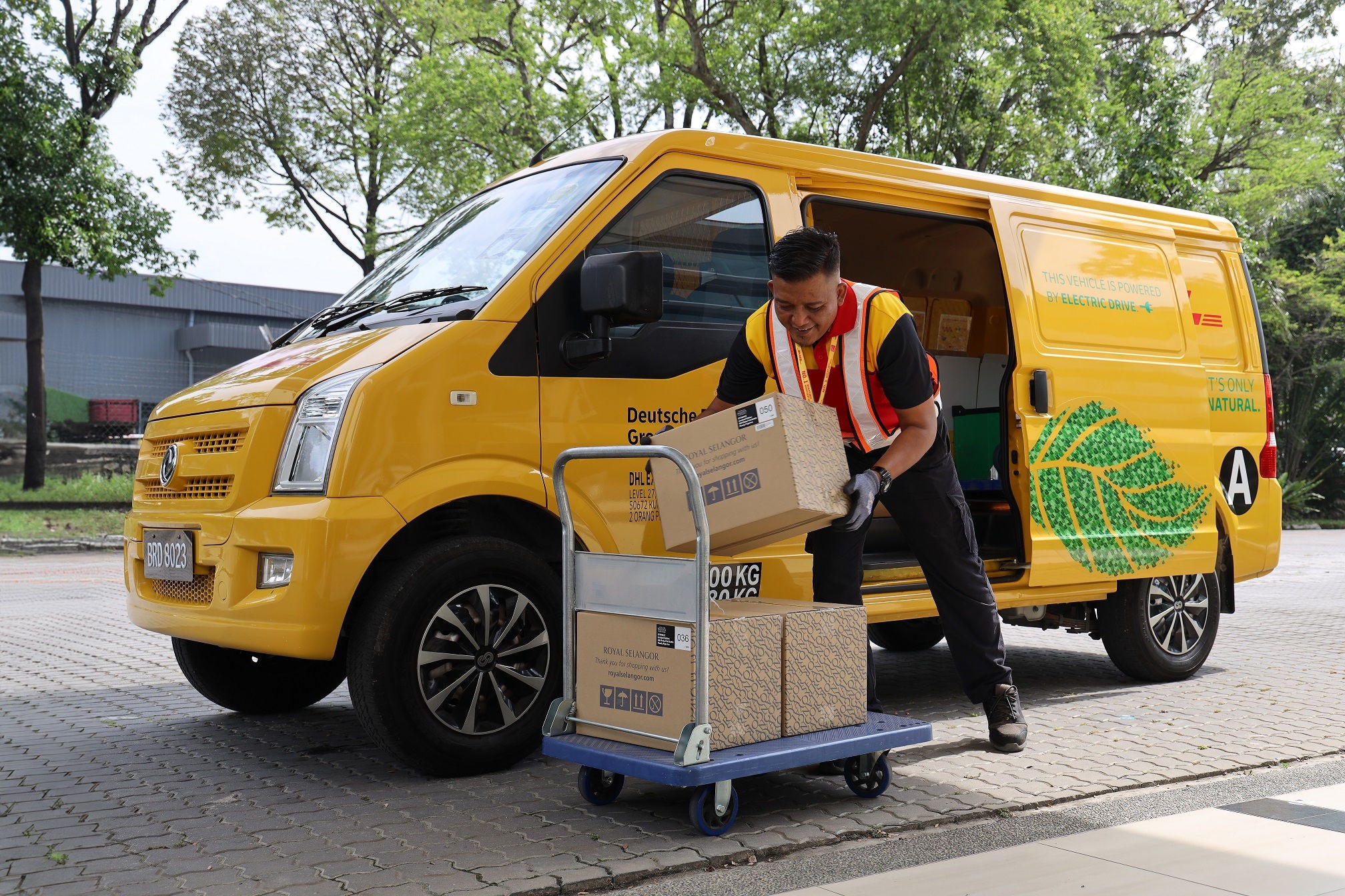 DHL Express courier moving Royal Selangor shipments