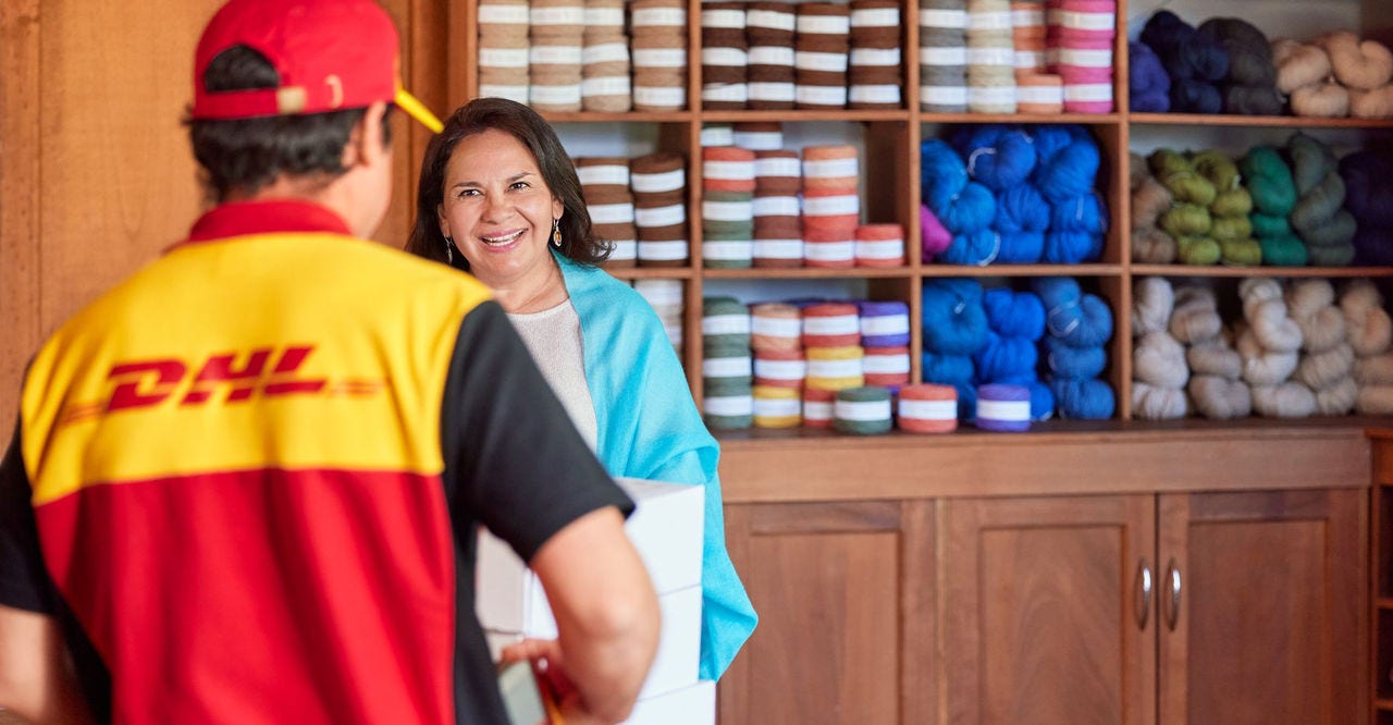 dhl express employee taking an on-demand delivery order