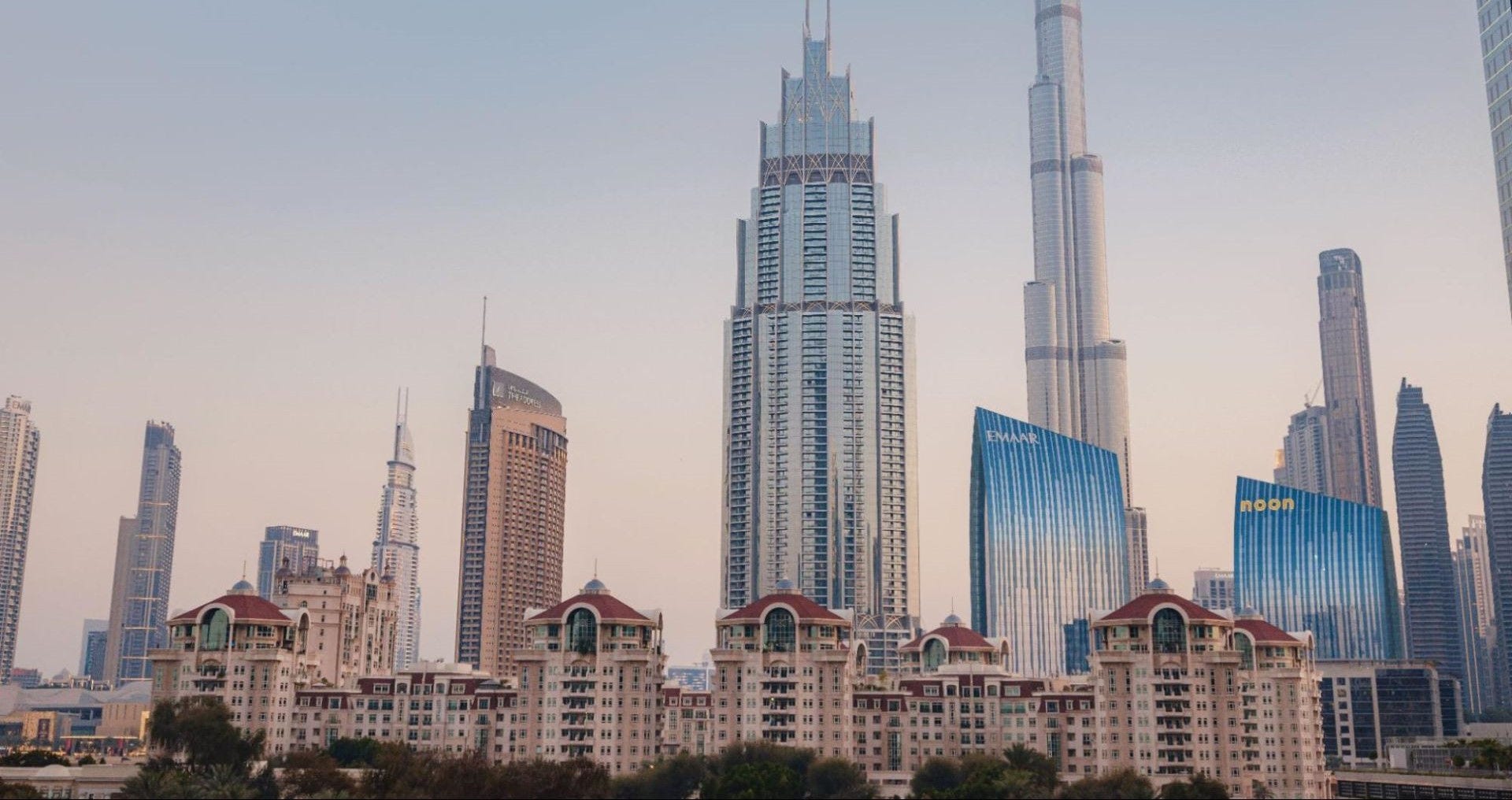  a city in the middle east with apartment buildings and skyscrapers