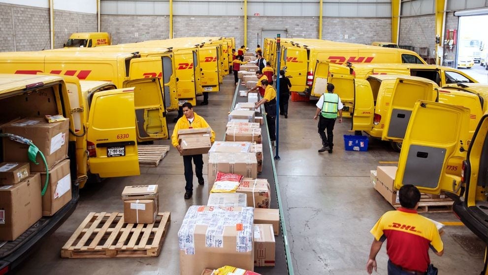 A busy DHL Express warehouse in operation