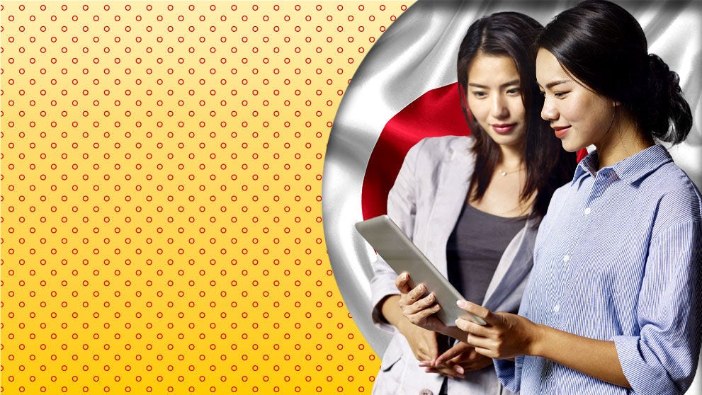 two ladies looking at tablet screen