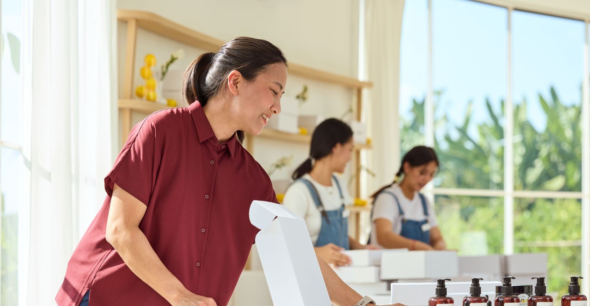 a shop owner packing cosmetics for exporting