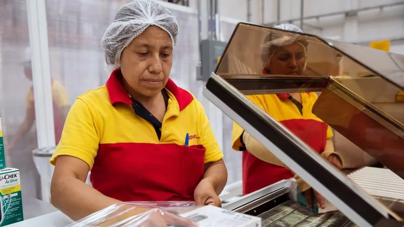 DHL employee handling medicine packing