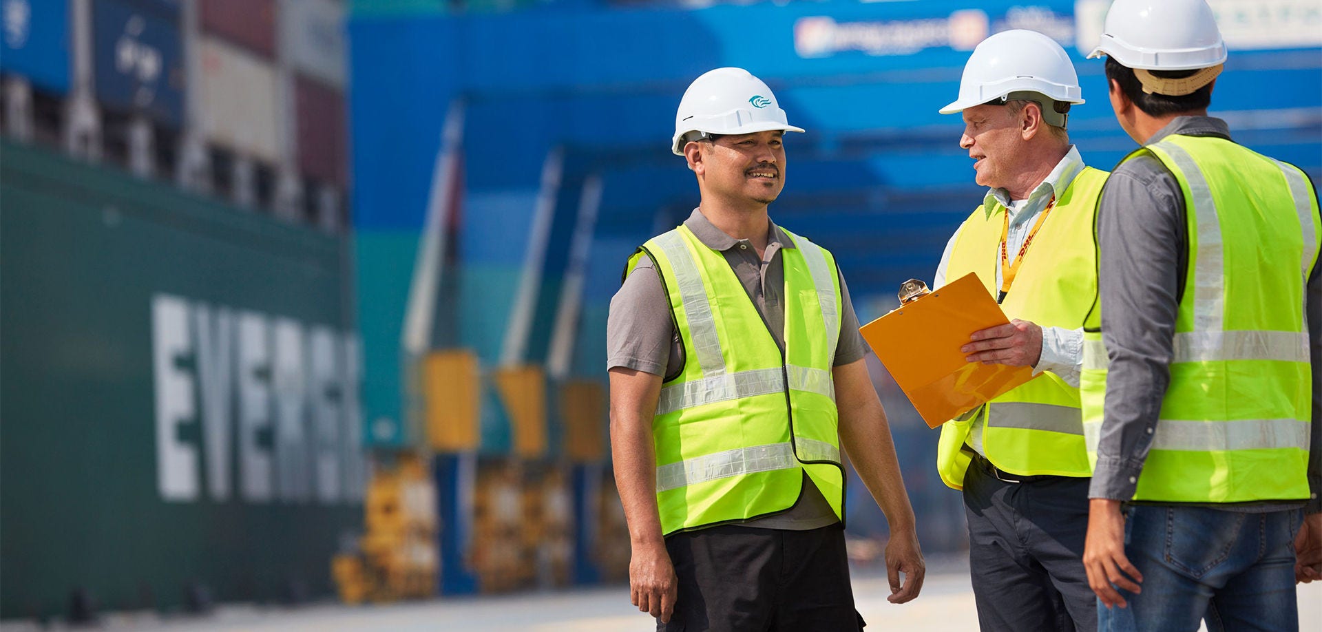 three men in hard hats talking