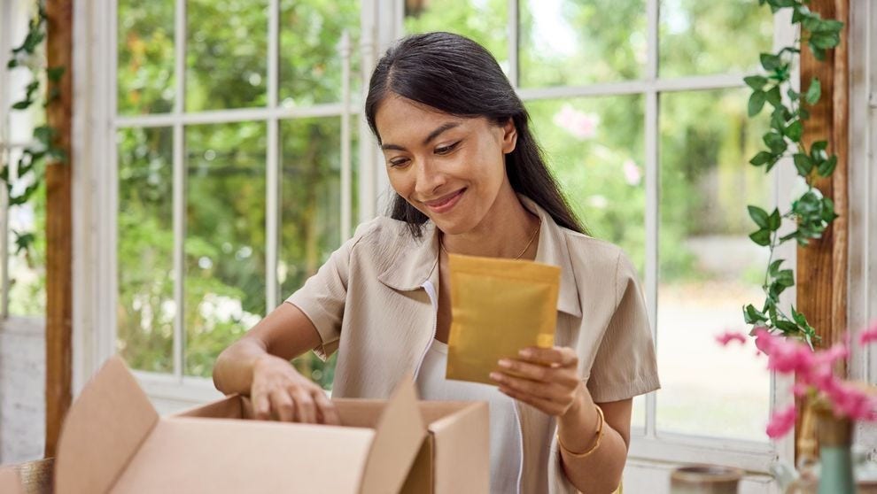 Filipina preparing their package for shipping from the Philippines