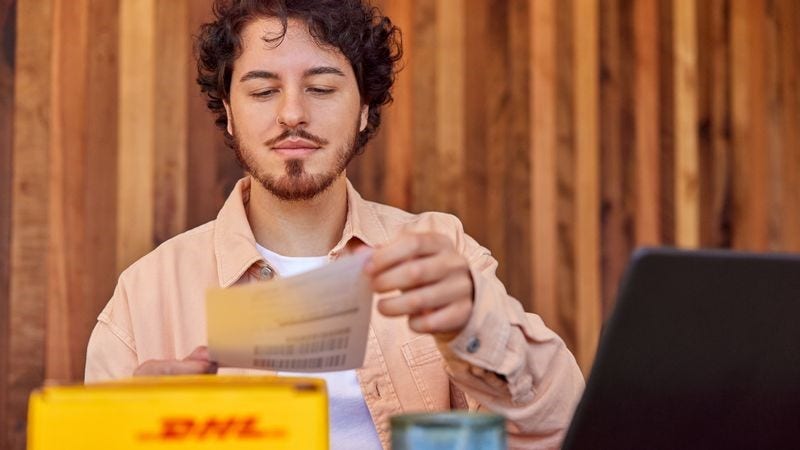 dhl express customer looking at a shipping sticker