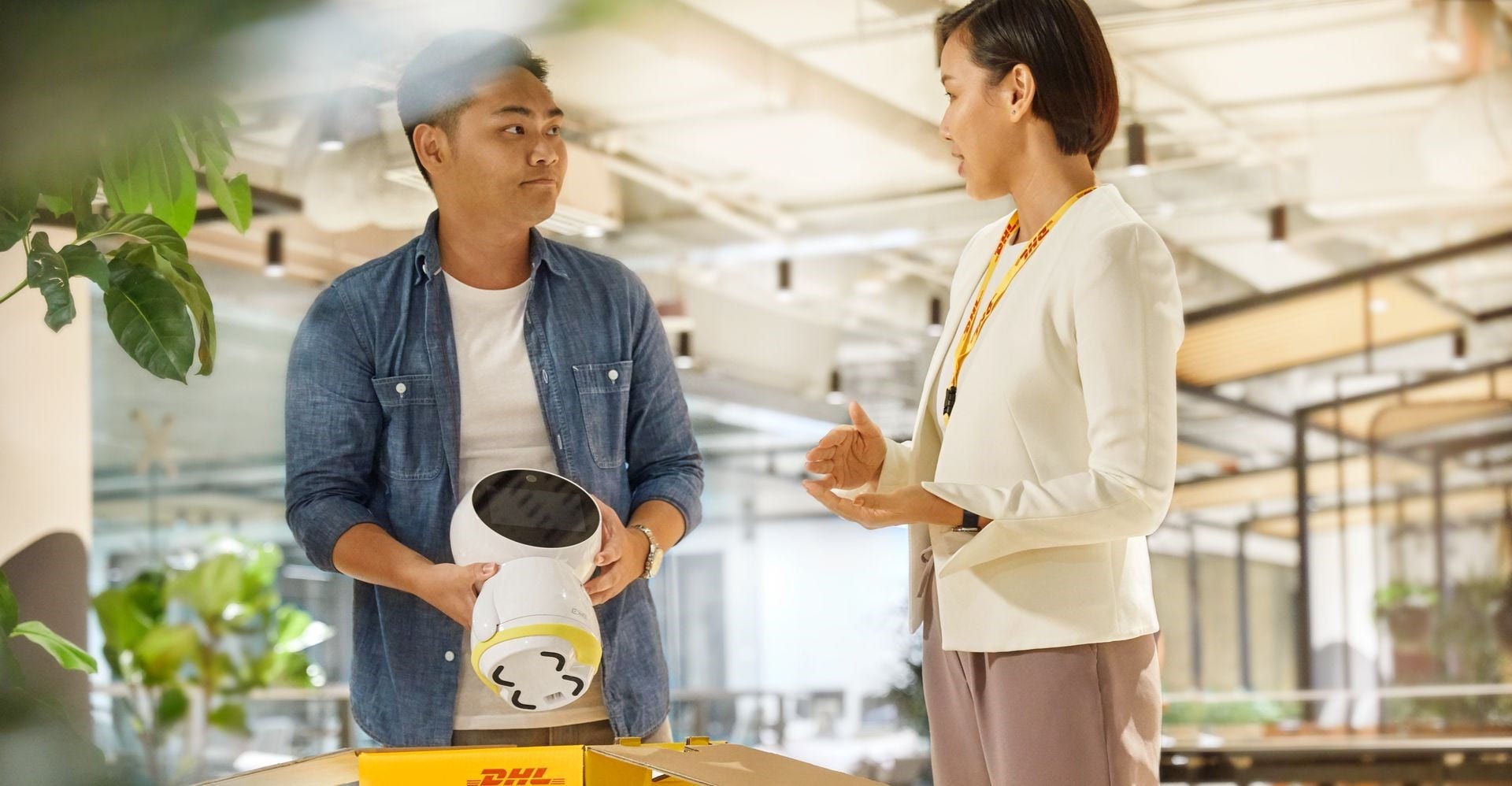 staff unpacking electronics from a dhl package