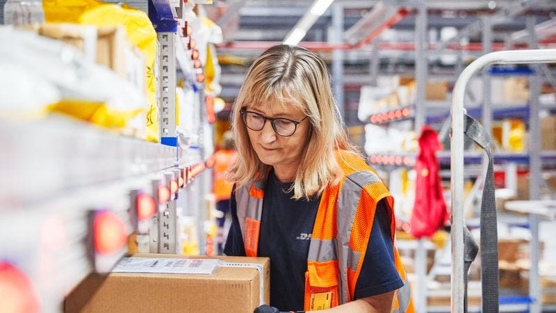 dhl express staff handling air freight boxes and verifying the shipping bill & air waybill