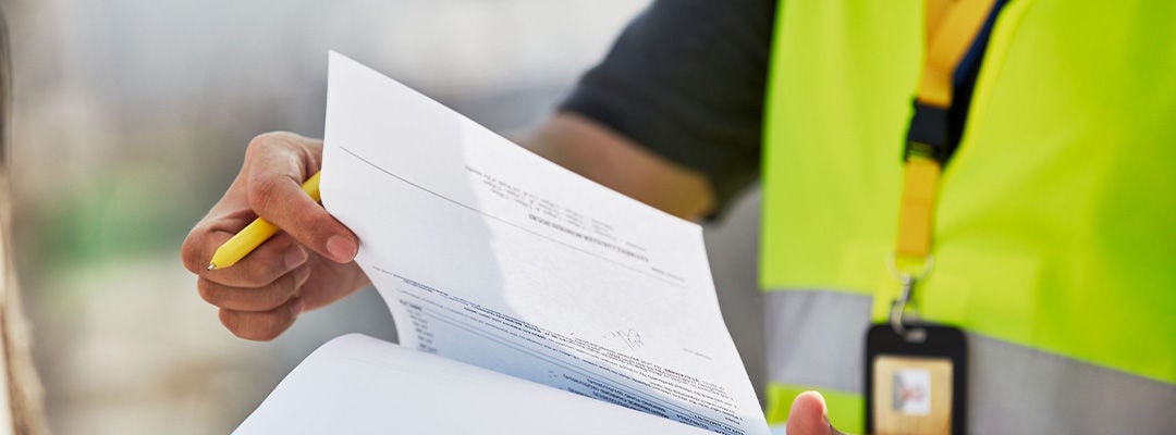 DHL employee holding a paper