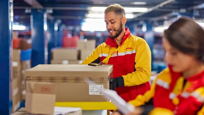 DHL employee checking small business export product