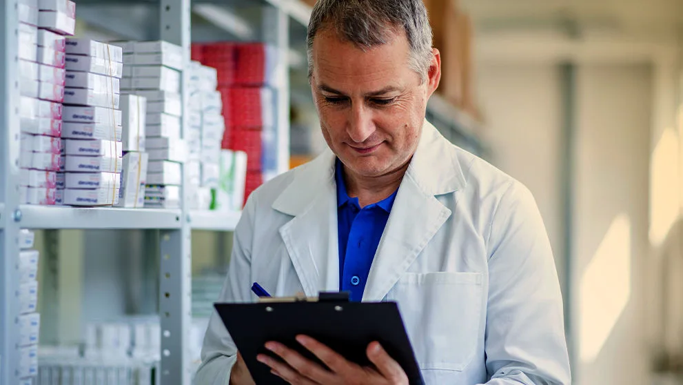 medical professional looking at clip board