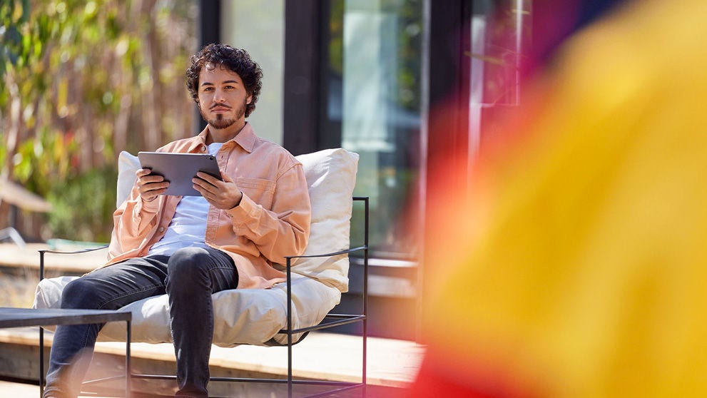 young man man looking at tablet screen