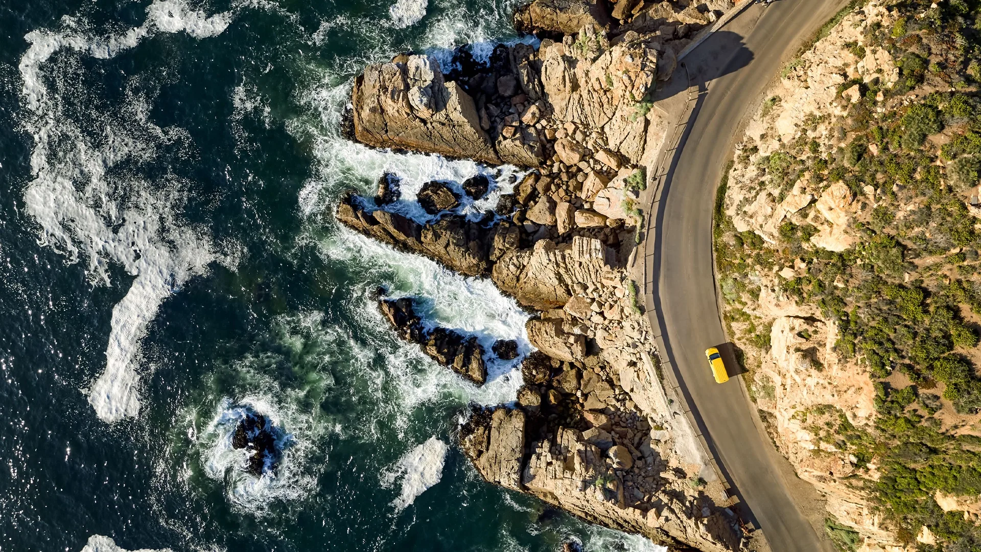 Aerial view of DHL van by the beach
