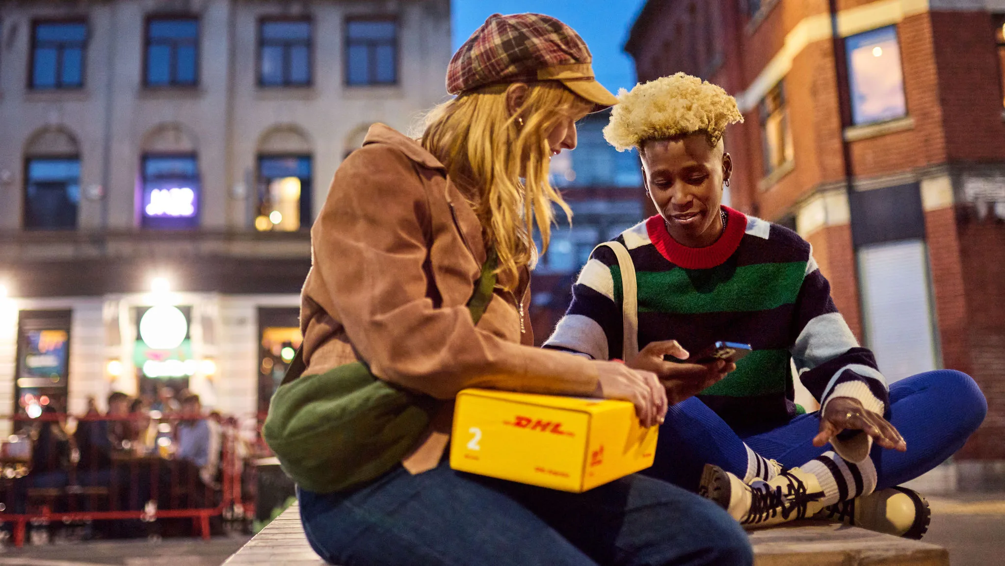 man and woman in headwrap smiling