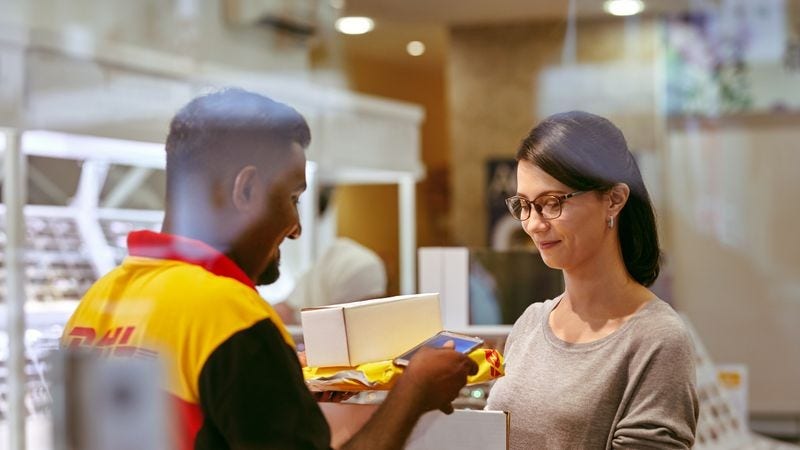 dhl employee making an ecommerce delivery