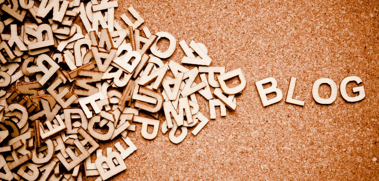 Lette pieces spelling out BLOG, with random letters on the left