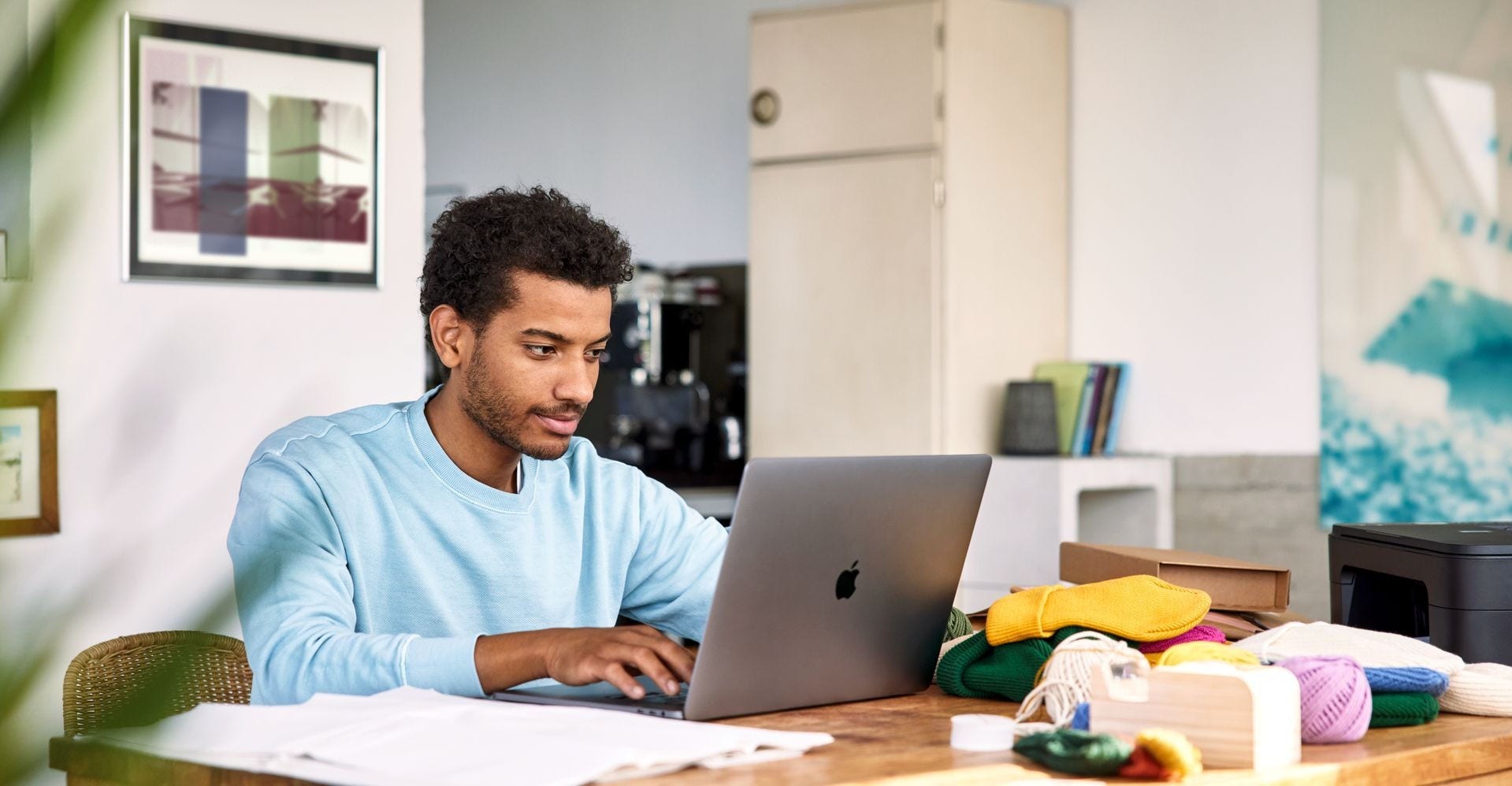 A man works on his laptop.