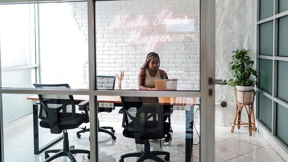 woman typing on a laptop