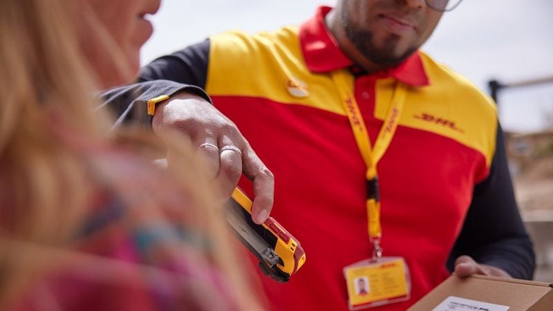 DHL Express parcel being scanned electronically