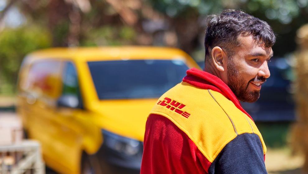 DHL Express employee about to deliver parcels