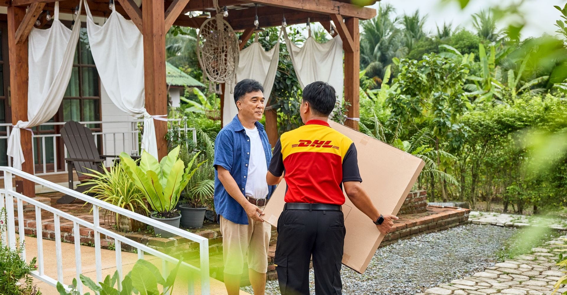 dhl express employee picking up a parcel for shipping from Cambodia