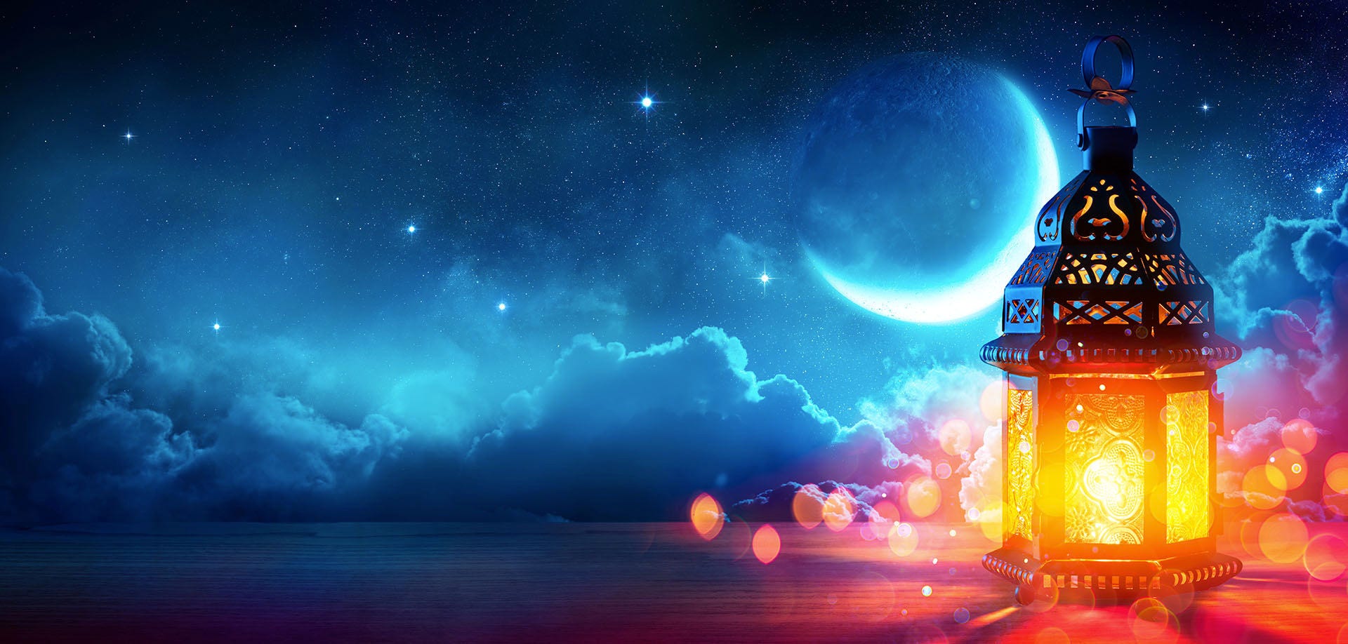 lamp overlooking a crescent moon
