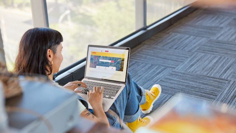 DHL Express customer using a laptop for invoice payment