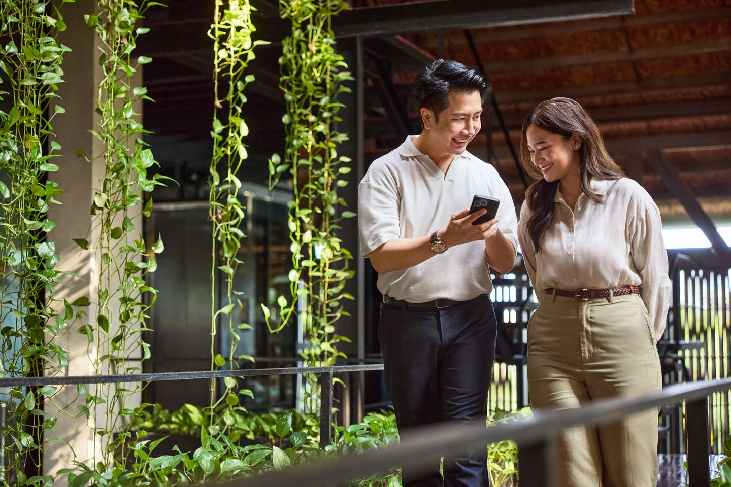 two asians walking and discussing the free trade agreements that singapore has