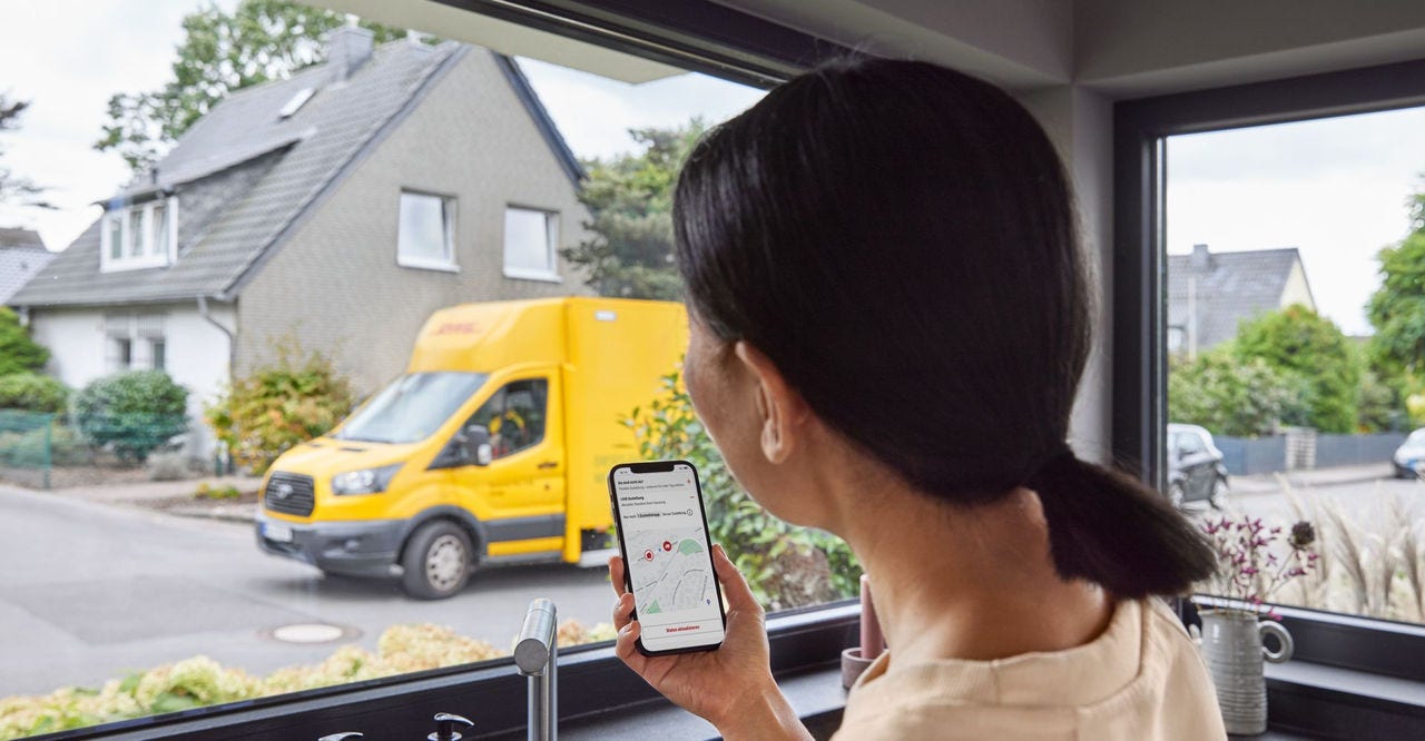 woman using AI in last mile delivery to track her parcel on a smartphone