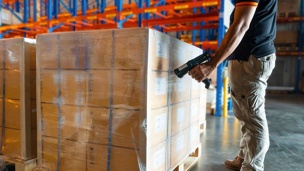 man scanning packages