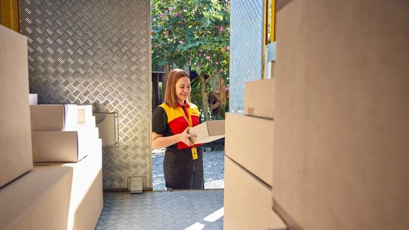 a business owner discussing import requirements from pakistan to bangladesh with a dhl employee