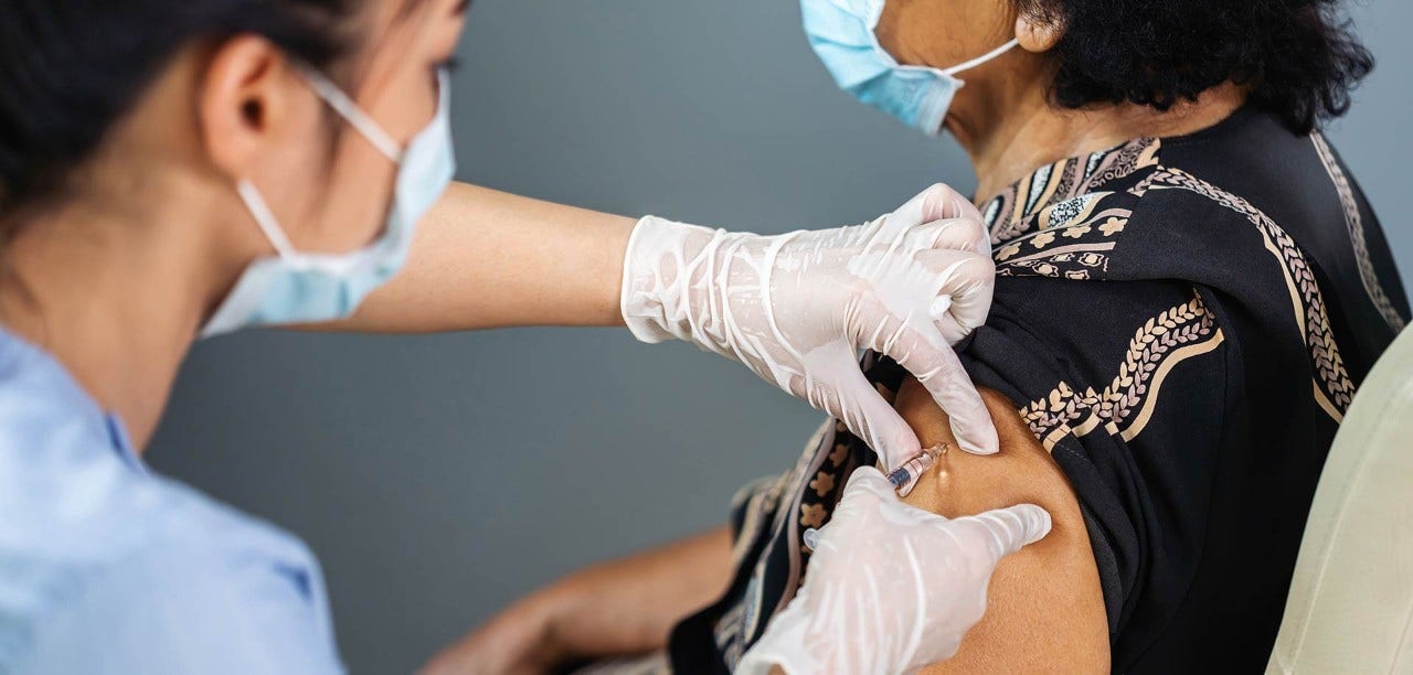 woman receiving vaccine