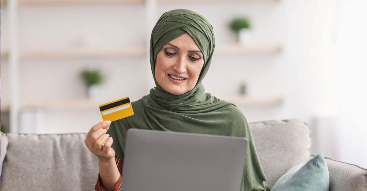 muslim woman using laptop to buy popular thai products