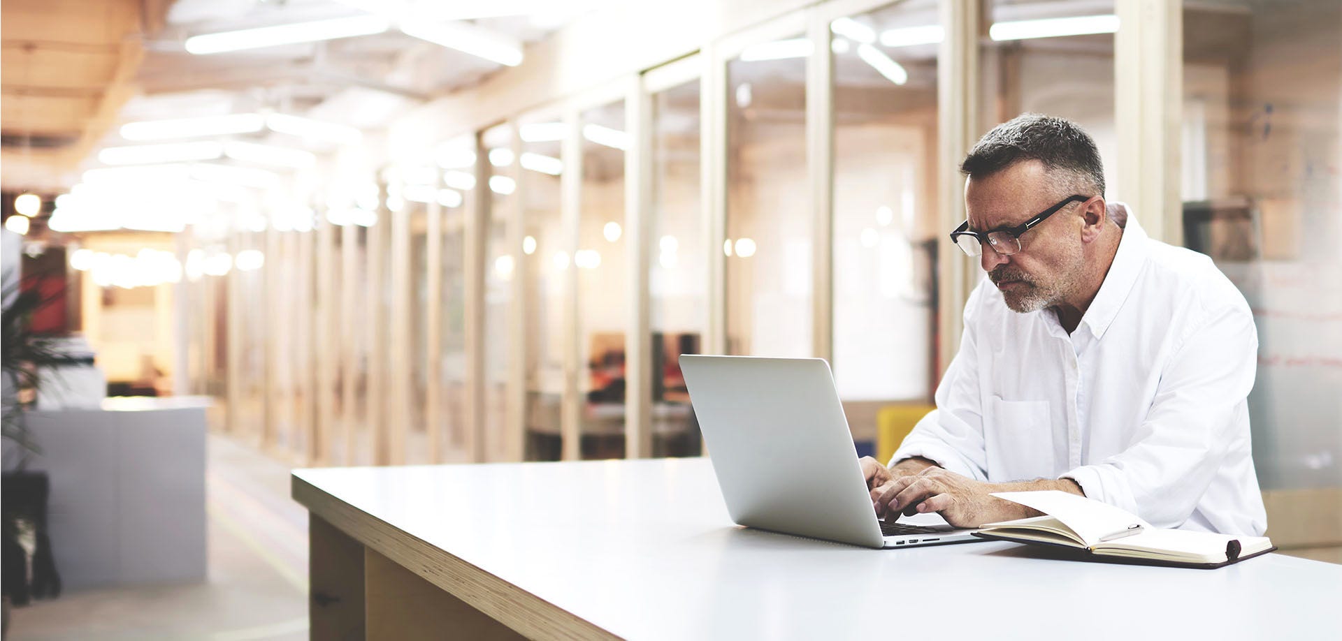 man looking at laptop screen