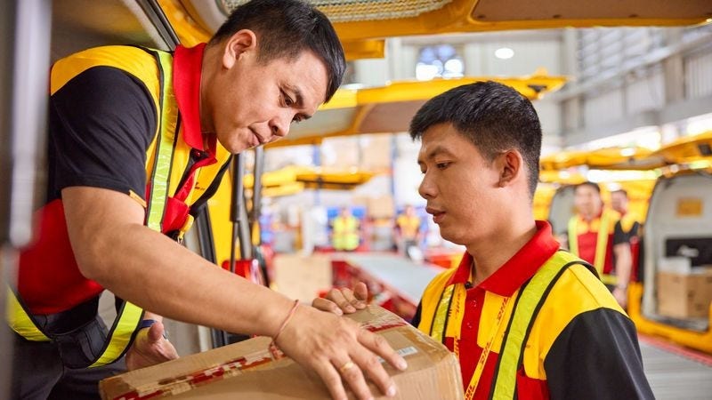 dhl express employees sorting parcel shipped from taiwan to the us